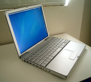 PowerBook with lid open, from left hand side.